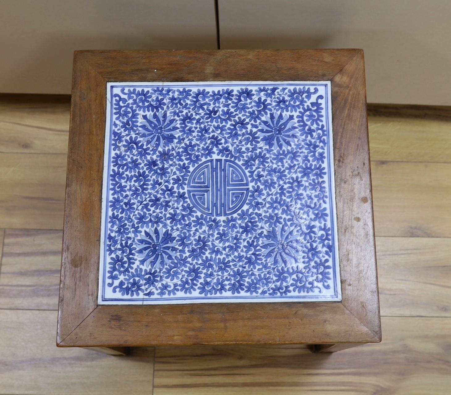 A Chinese hardwood and blue and white porcelain inset table, 42cm square